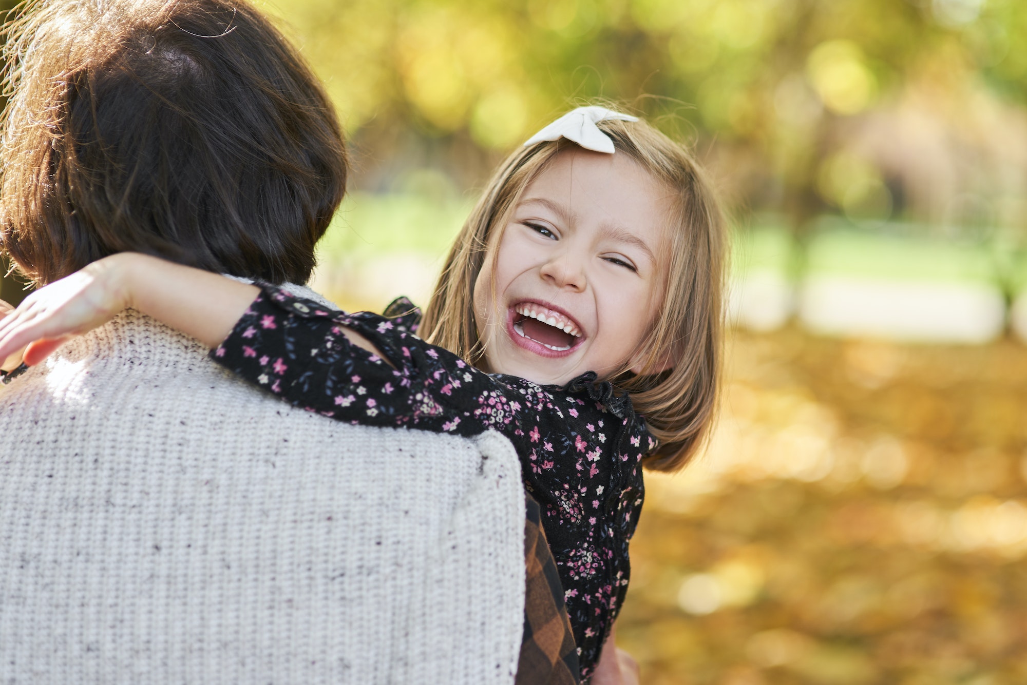 Portrait of happy girl embracing her daddy