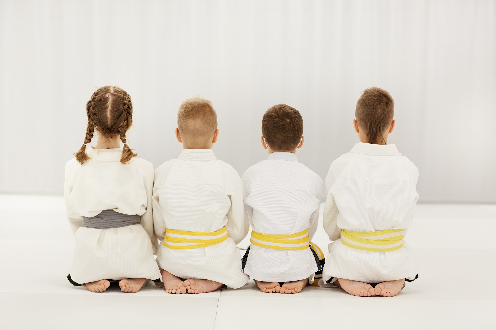 Children in kimono doing judo